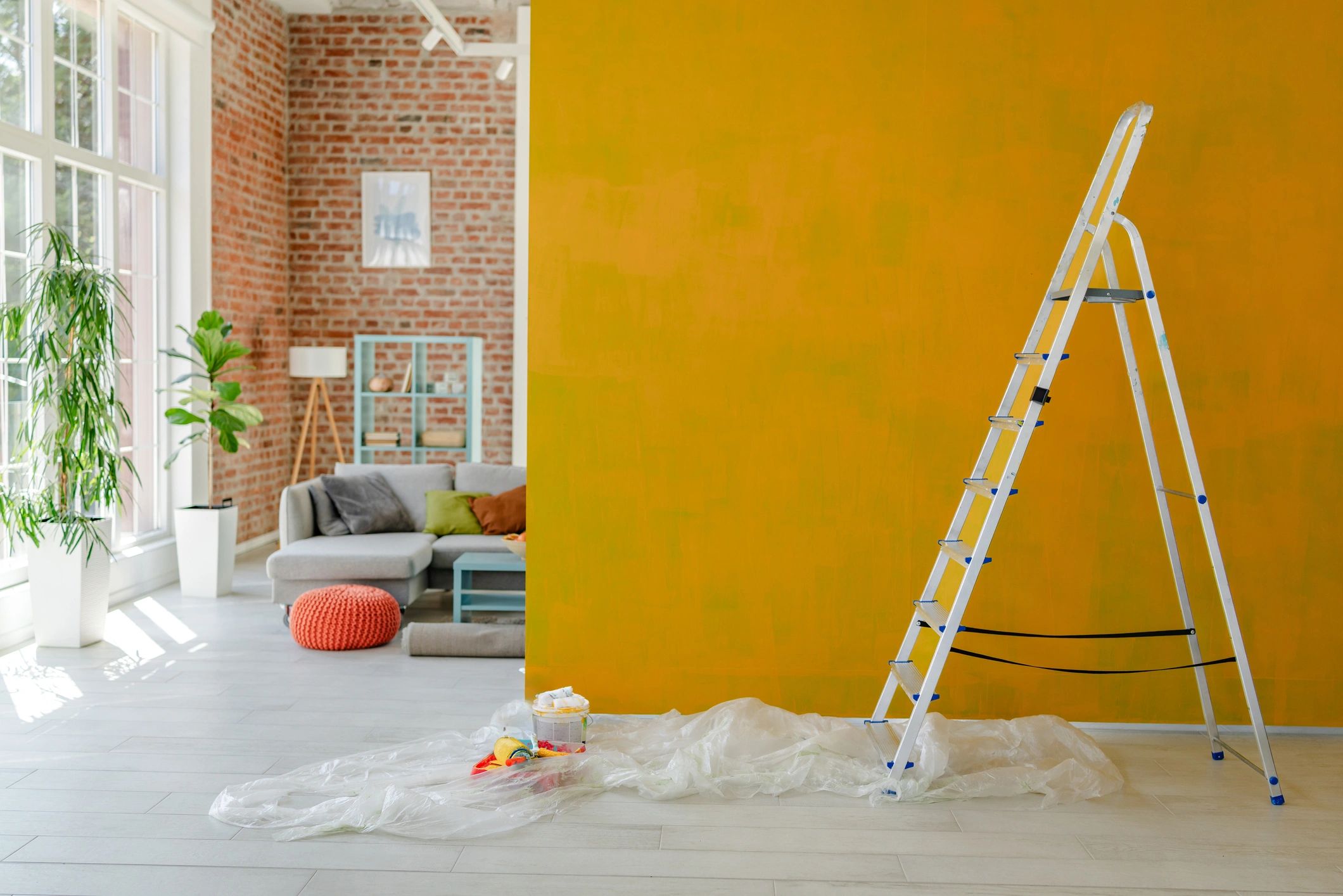 Interior space during renovation with ladder and painted wall