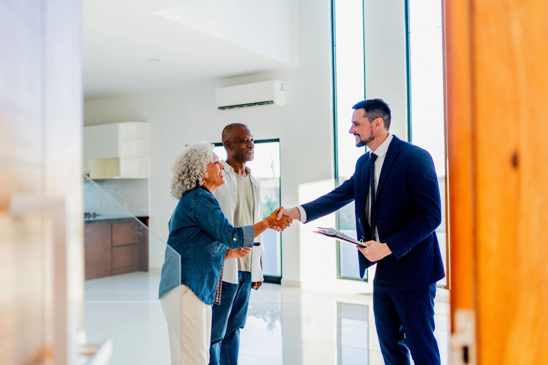 Homeowners meeting with a real estate professional