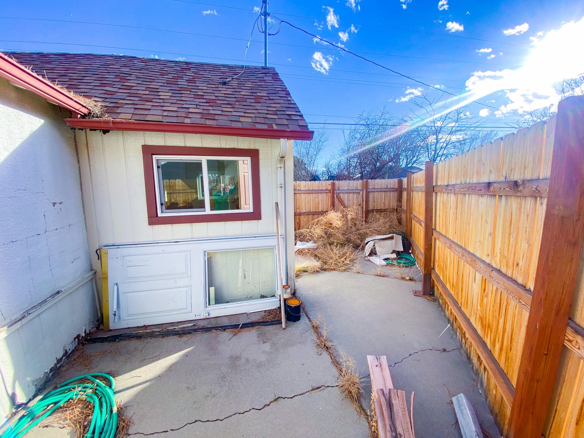 Older home exterior with fenced yard